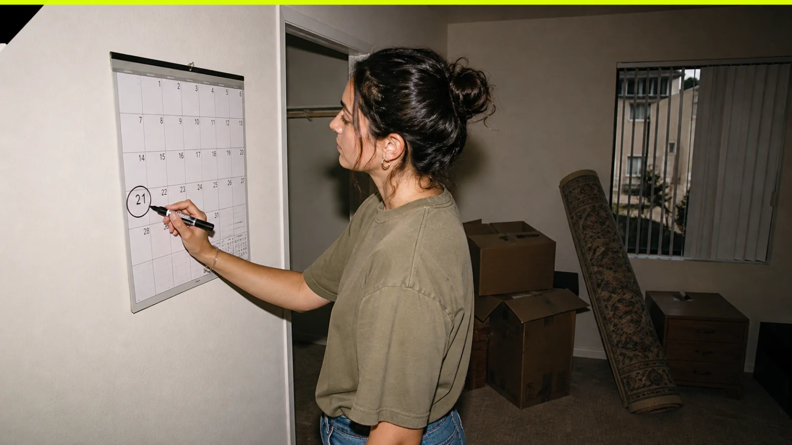 California renter reviewing a move-out calendar and security deposit records at a kitchen table